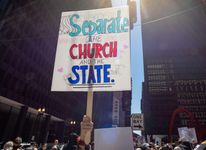 “Separate the church and the state” reads a sign favoring political secularism